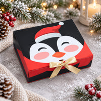 Presentbox med pingvin och guldfärgad rosett