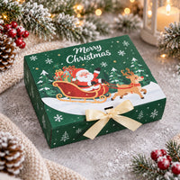 Grön julbox med tomte i släde